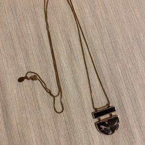 Faux marble necklace with gold colored chain